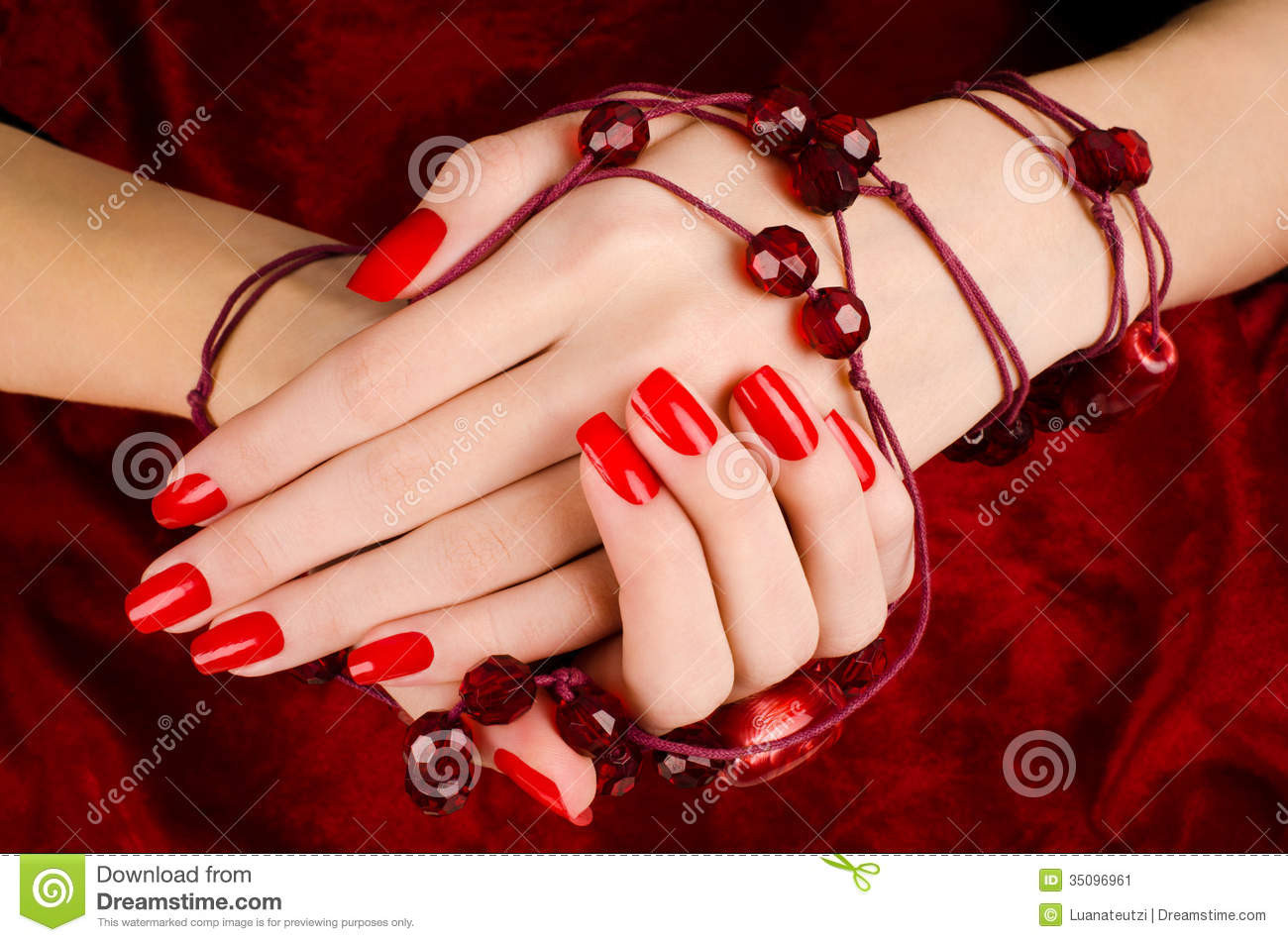 close-up-beautiful-female-hands-sexy-red-manicure-woman-velvet-background-35096961.jpg