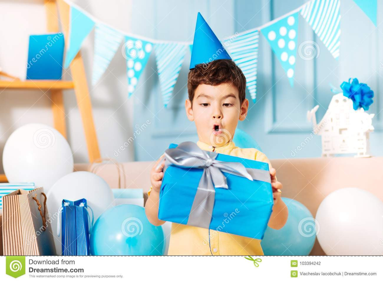 little-boy-looking-his-birthday-gift-surprise-incredible-adorable-holding-blue-box-present-sur...jpg